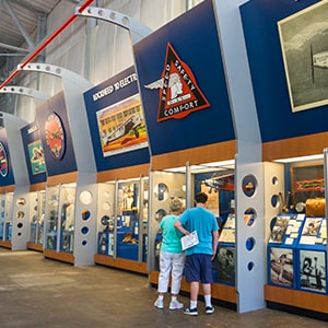 Visitors enjoying the exhibits at the Delta Flight Museum.