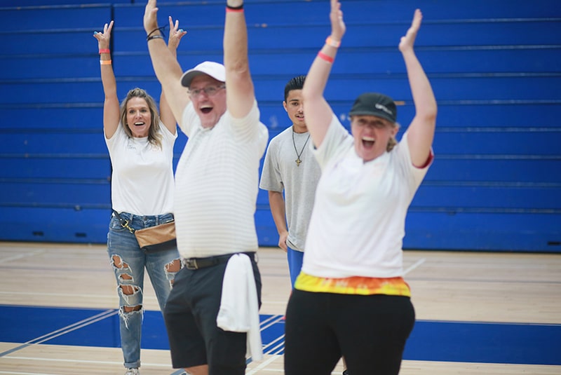 Volunteers having fun during a team building exercise.