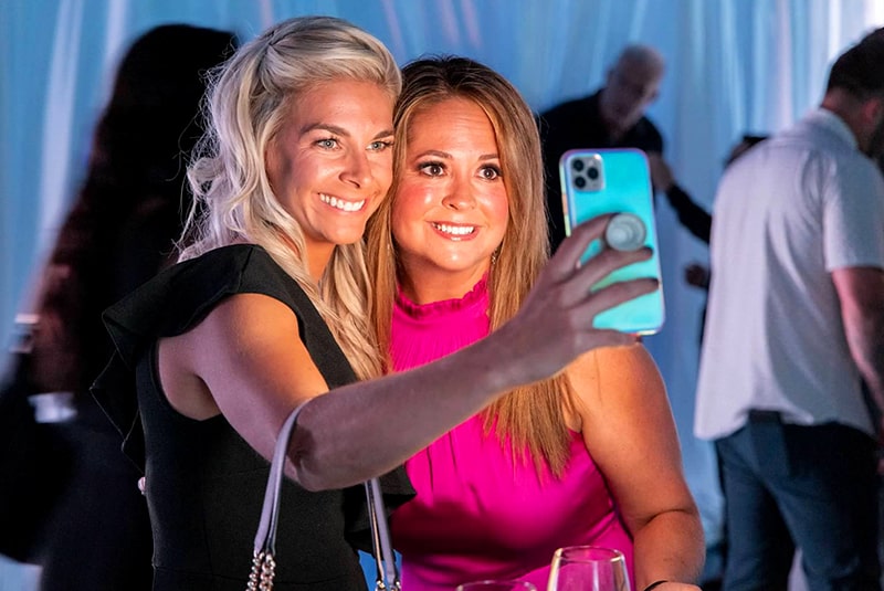 Two women taking a selfie together, smiling.