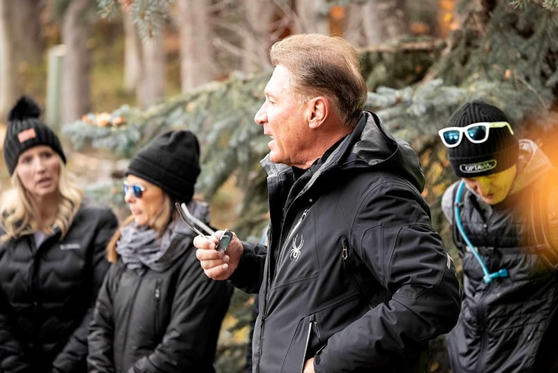 Dr. A speaking to Coaches outside on Stewart Falls hike.