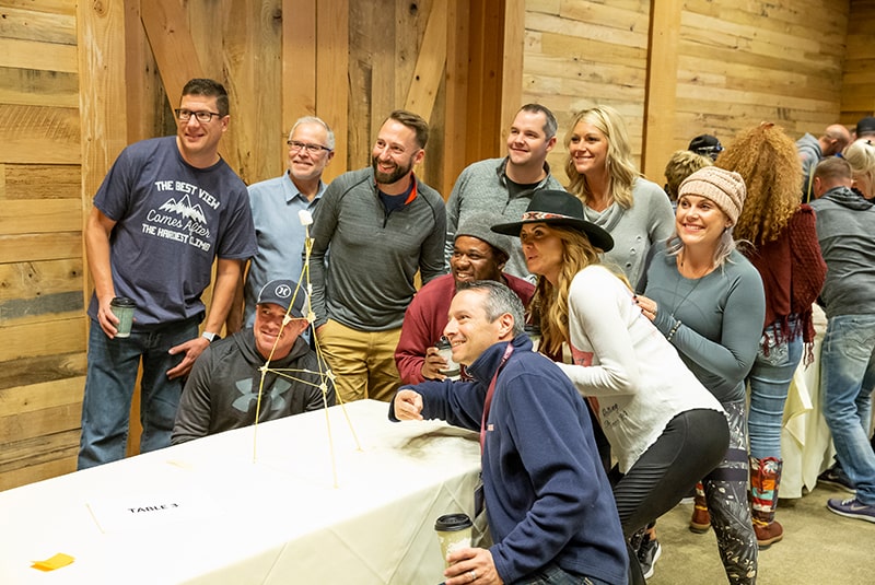 Coaches posing in group shot during a team building activity.